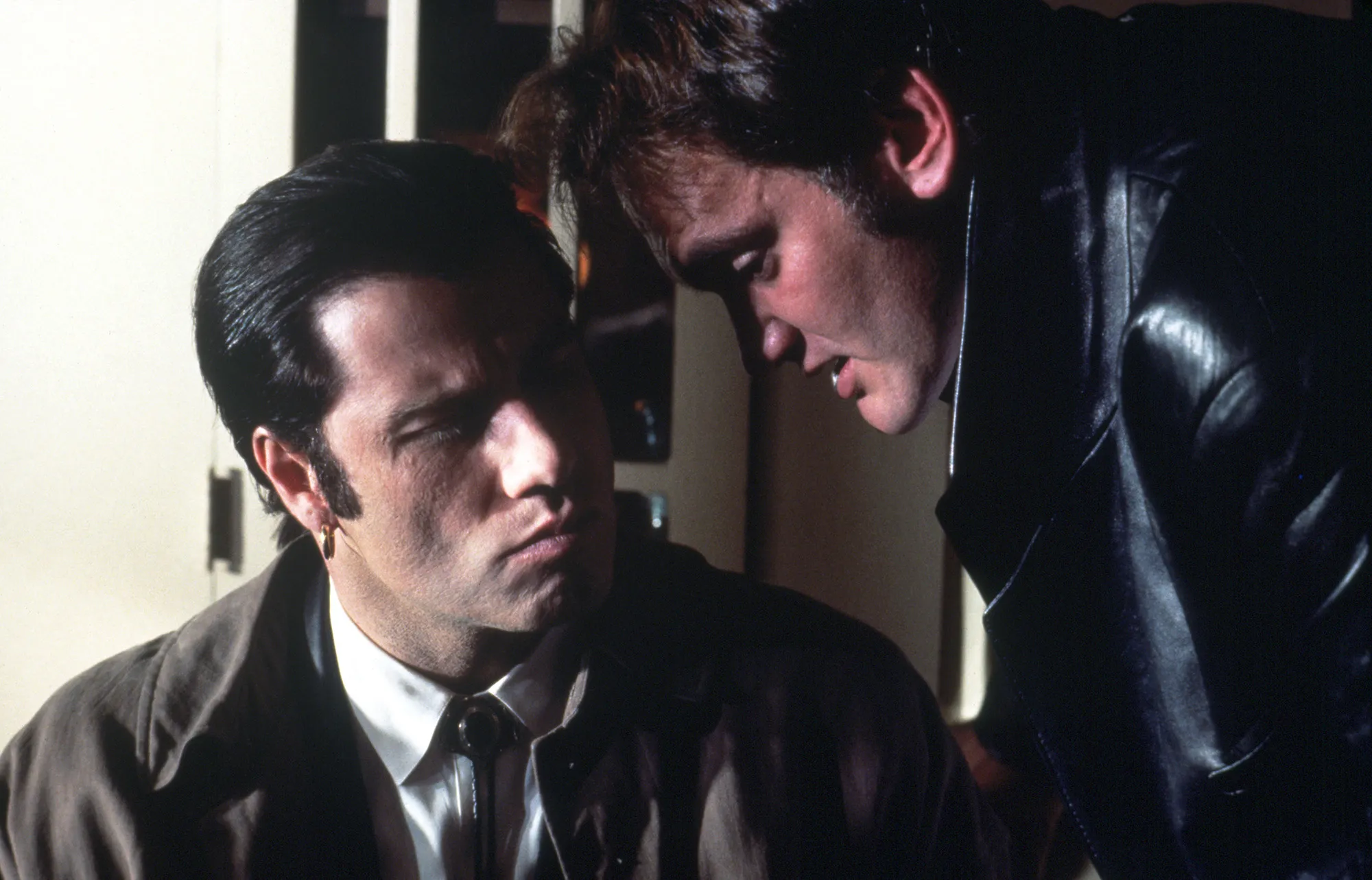 Director Quentin Tarantino speaks to actor John Travolta behind the scenes of “Pulp Fiction.”