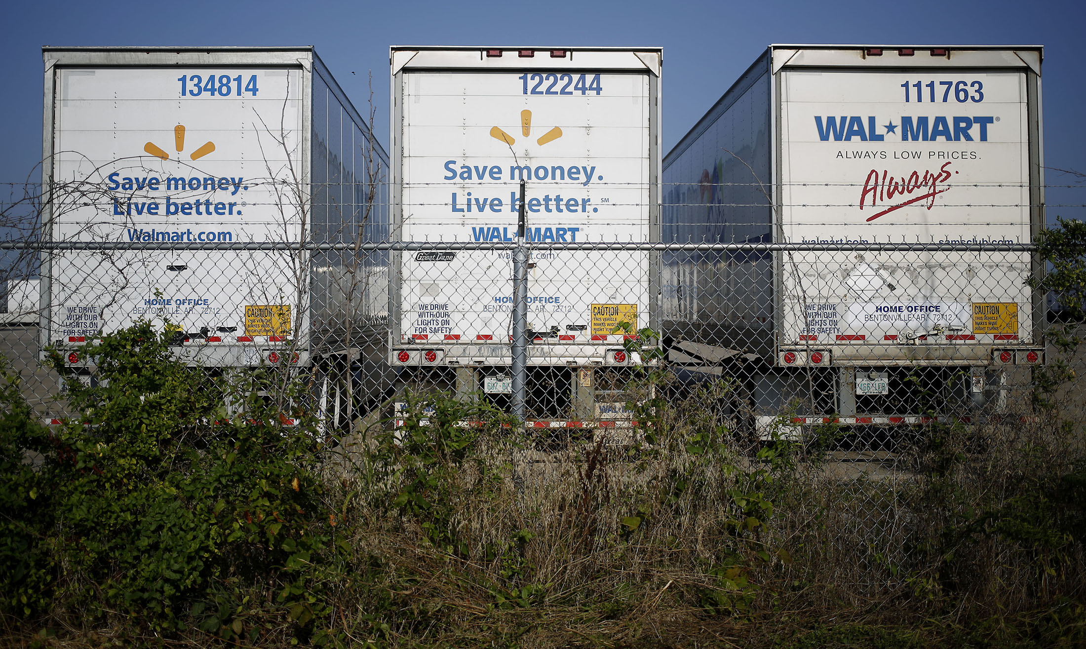 Tractor trailers sit parked outside a Walmart Stores Inc. distribution center in Bentonville, Arkansas.
