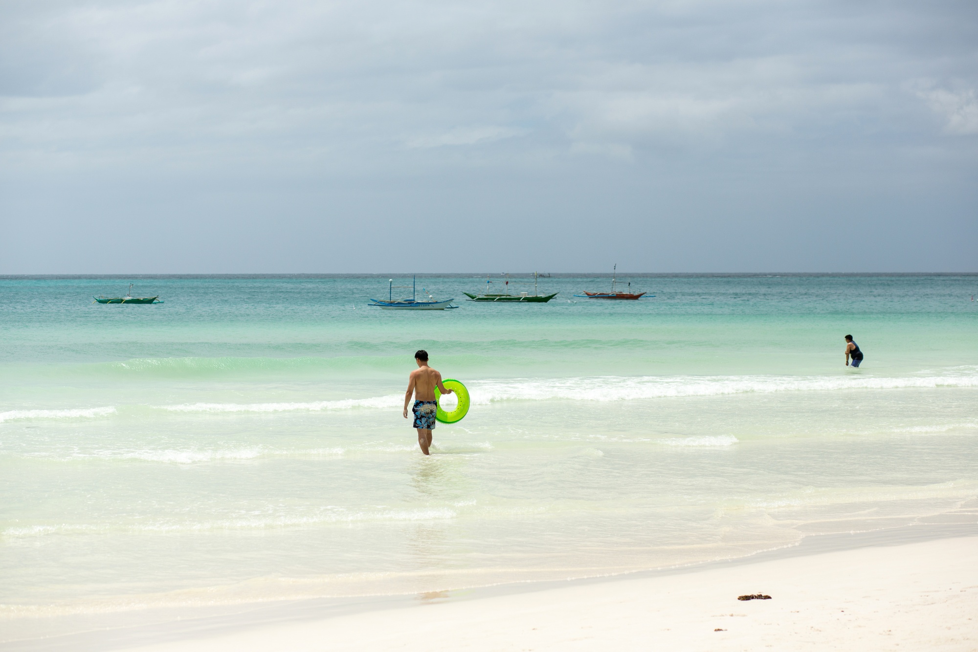 A lone tourist&nbsp;walks&nbsp;into the sea at&nbsp;Boracay in&nbsp;the Philippines. Southeast Asia's heavy reliance on Chinese tourists&nbsp;means the disruptions caused by China’s Covid Zero&nbsp;policy&nbsp;are dealing a huge economic blow.