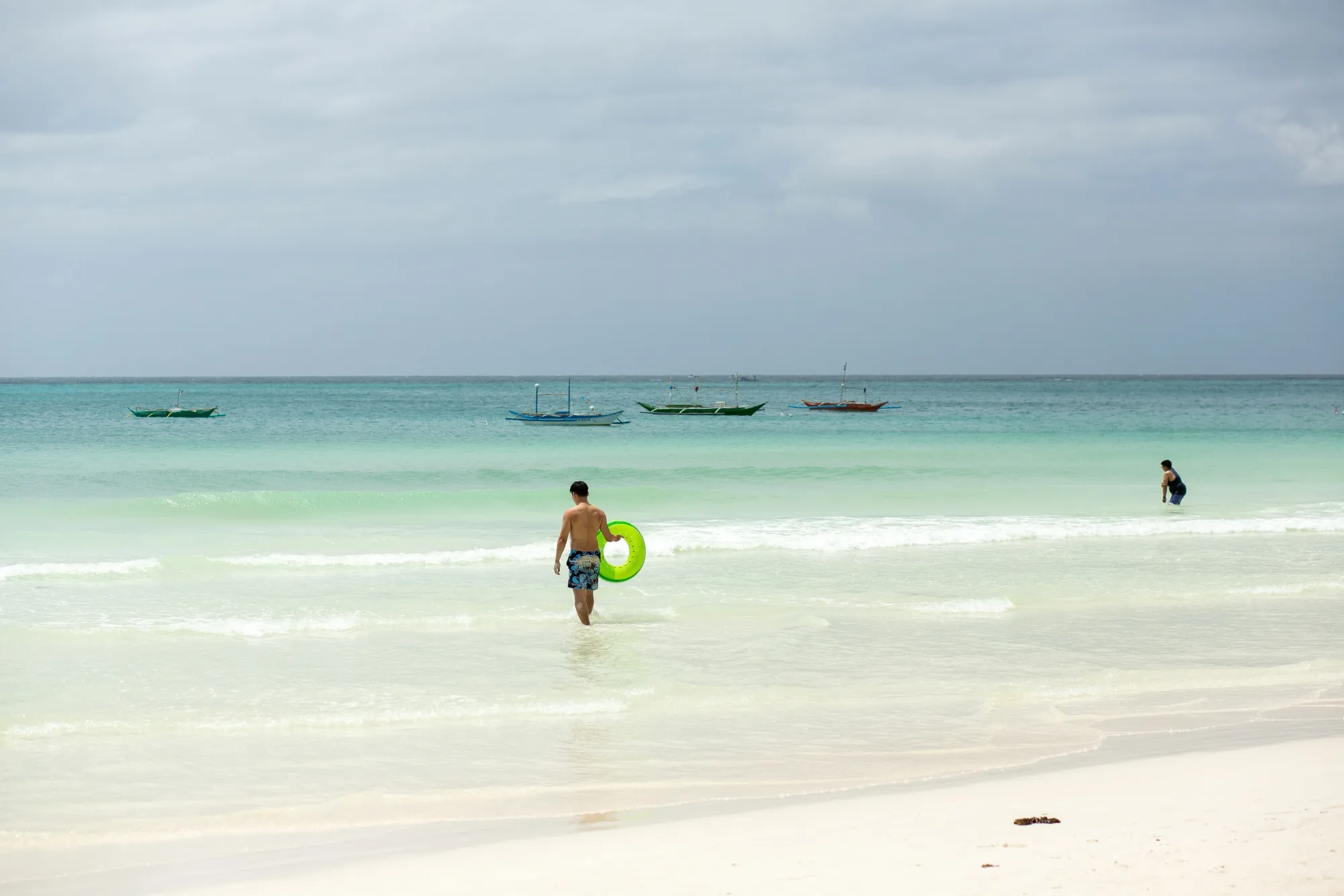 A lone tourist&nbsp;walks&nbsp;into the sea at&nbsp;Boracay in&nbsp;the Philippines. Southeast Asia's heavy reliance on Chinese tourists&nbsp;means the disruptions caused by China’s Covid Zero&nbsp;policy&nbsp;are dealing a huge economic blow.