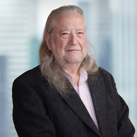 Stylized headshot in Bloomberg office of Aaron Brown