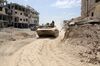 A picture taken on April 8, 2018, shows Syrian Army soldiers advancing in an area on the eastern outskirts of Douma