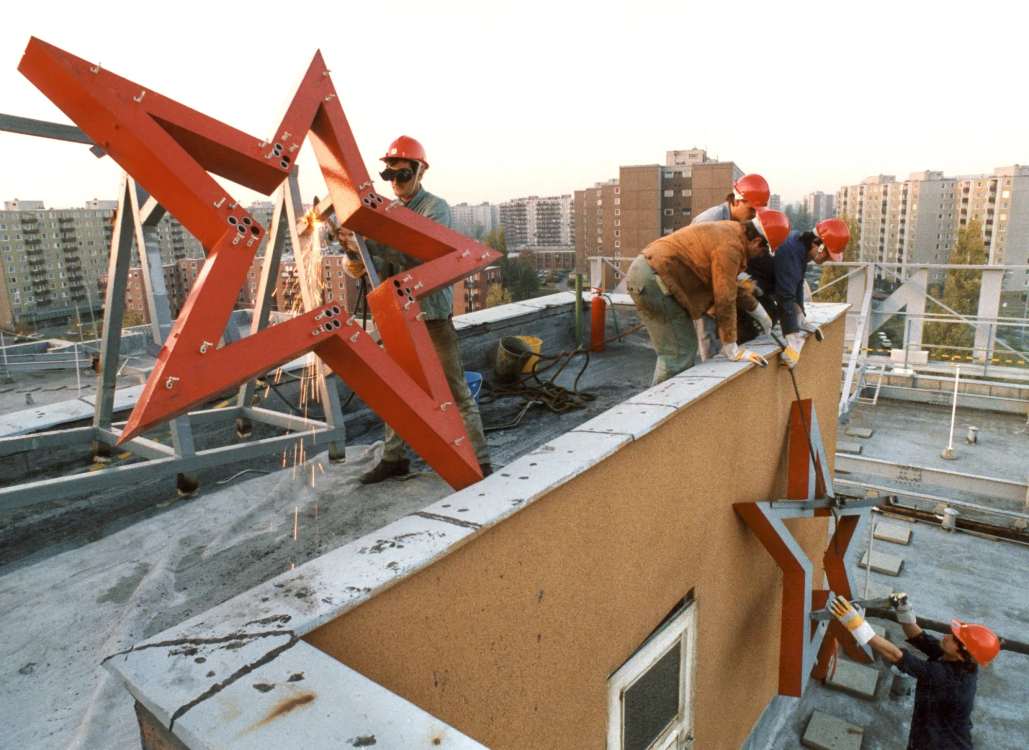 A red star is removed from the top of a factory in Budapest, on Oct. 26, 1989.