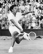 Althea Gibson, in action at Wimbledon in 1957.