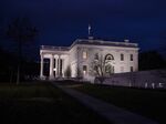The White House stands at night in Washington, D.C.