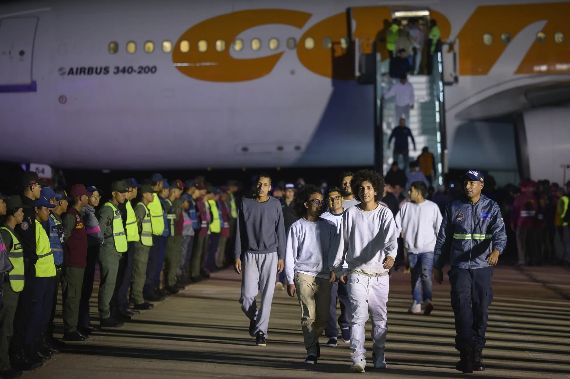 Deported individuals from the US arrive on a flight at Simon Bolivar International Airport in Maiquetia, Venezuela, on March 24.