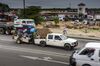 A truck tows a trailer loaded with goods near the border crossing with Zimbabwe.