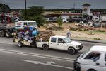 A truck tows a trailer loaded with goods near the border crossing with Zimbabwe.