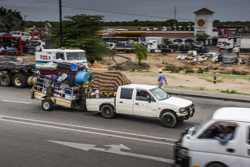 A truck tows a trailer loaded with goods near the border crossing with Zimbabwe.