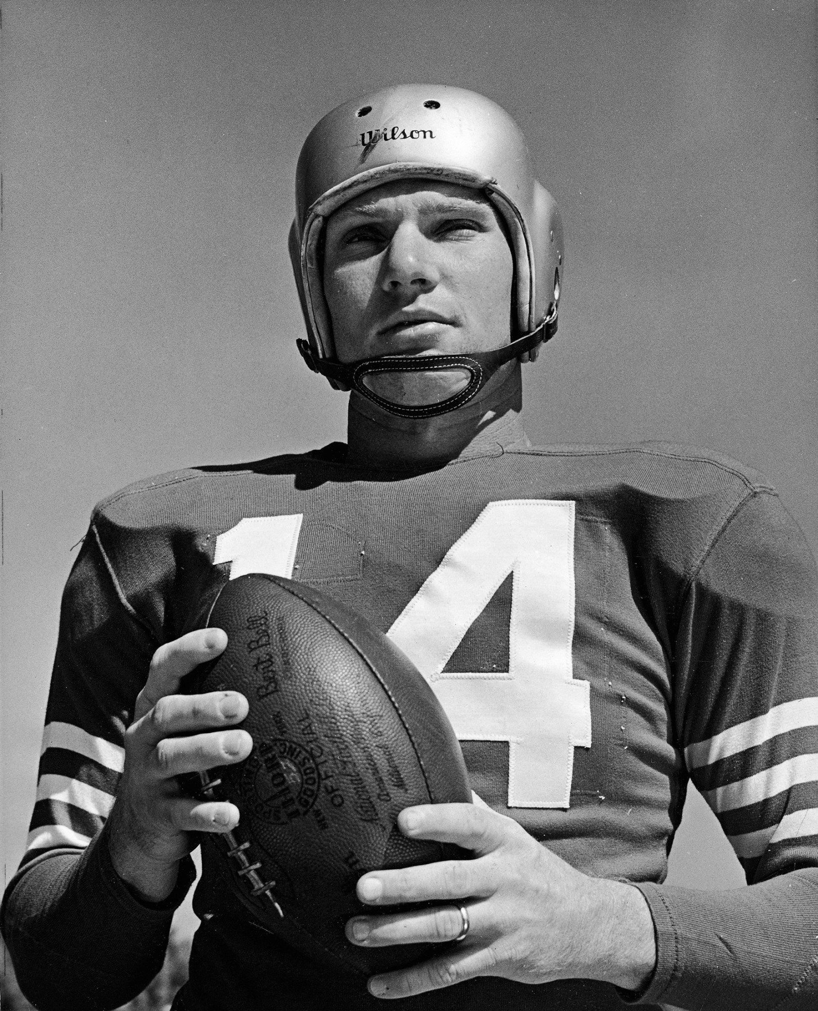 New York Giants quarterback Y.A. Tittle (14) is assisted from the