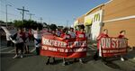 Demonstrators gather outside a McDonald's restaurant as part of the &quot;Fight for $15&quot; campaign.