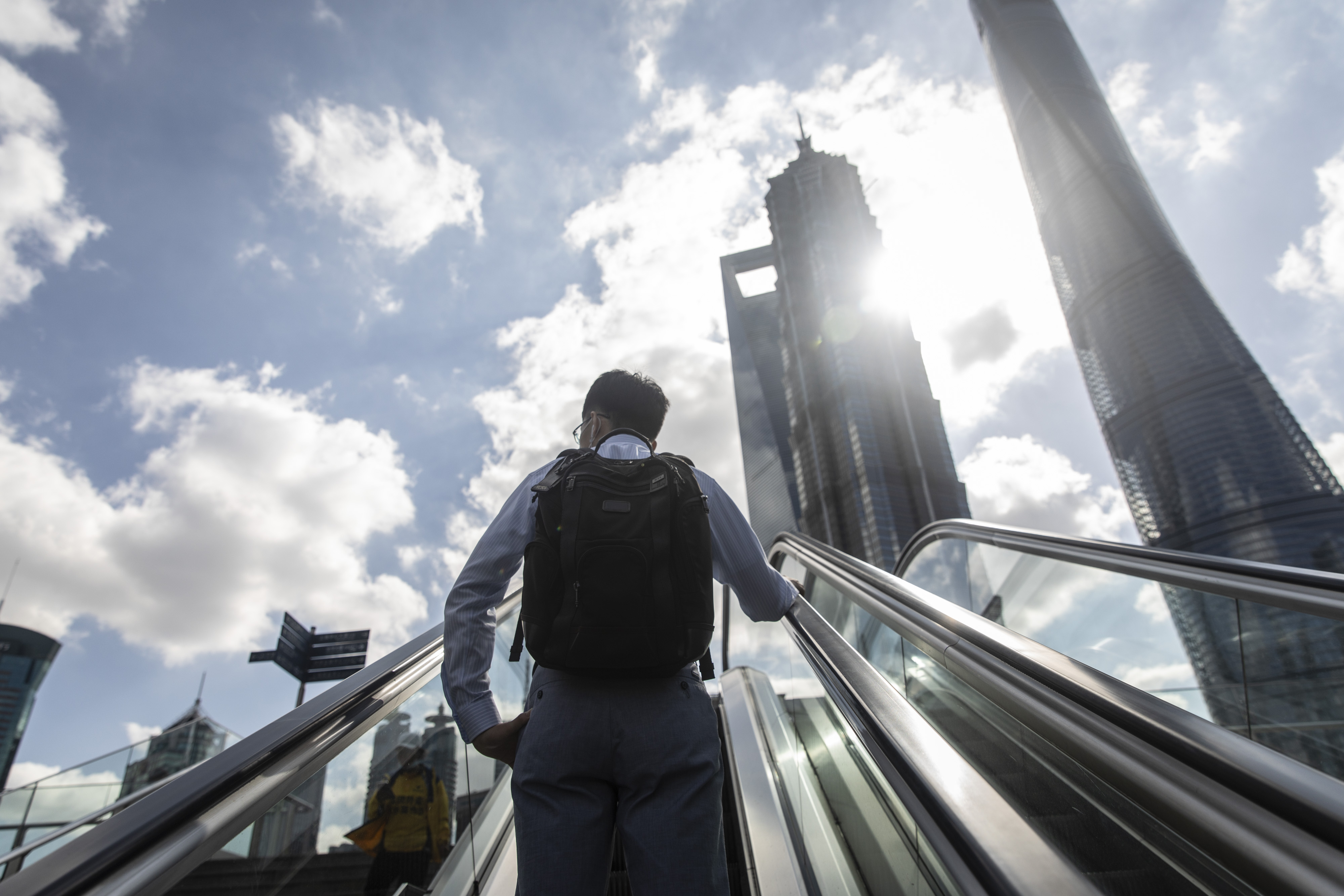 A morning commuter heads towards the Lujiazui Financial District in Shanghai on Oct. 9.