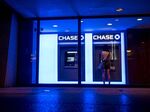 A customer uses an automatic teller machine (ATM) at a JPMorgan Chase & Co. bank branch in Chicago.