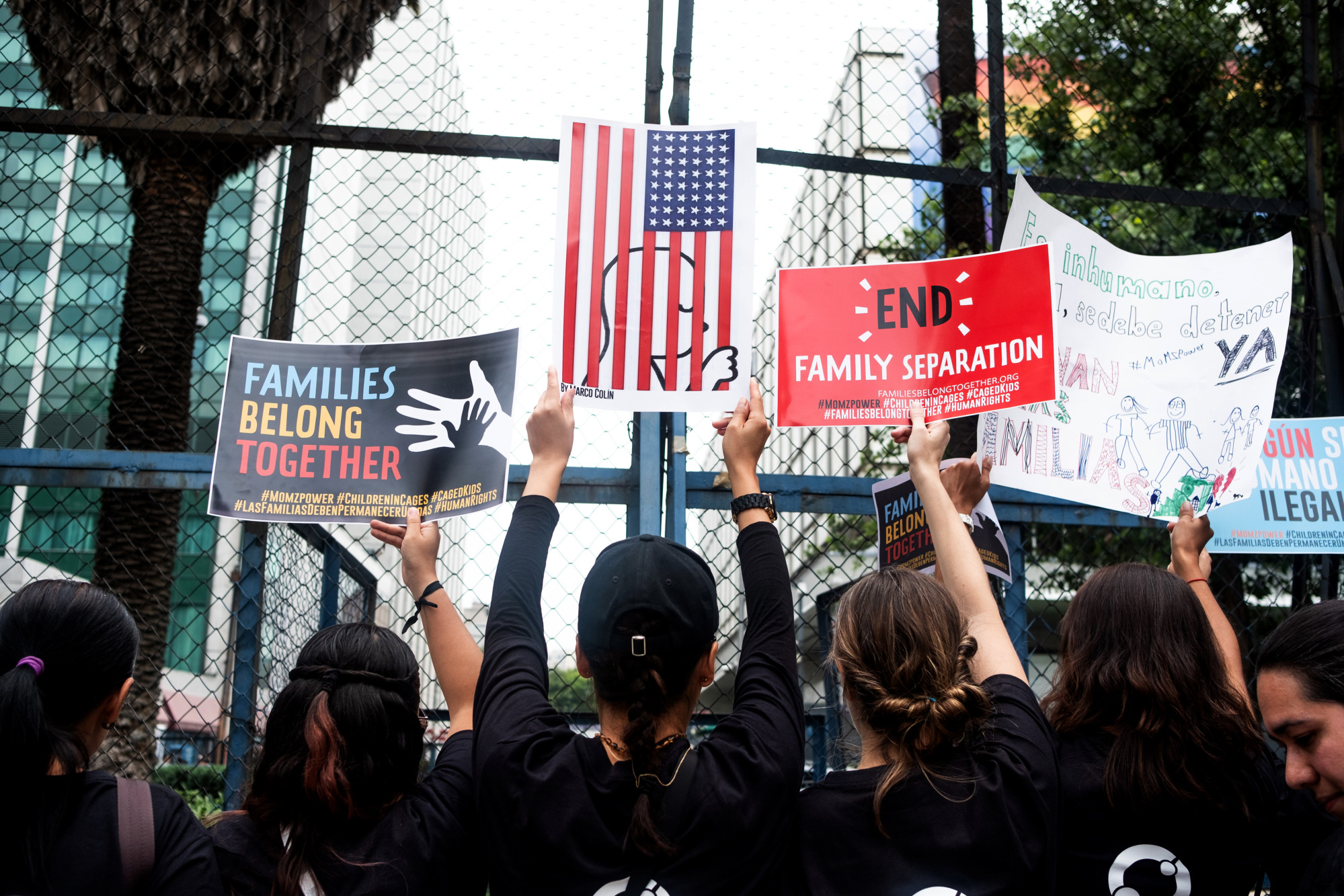 Protesters hold placards during a 'Families Belong Together' rally outside the U.S. Embassy in Mexico City, Mexico.