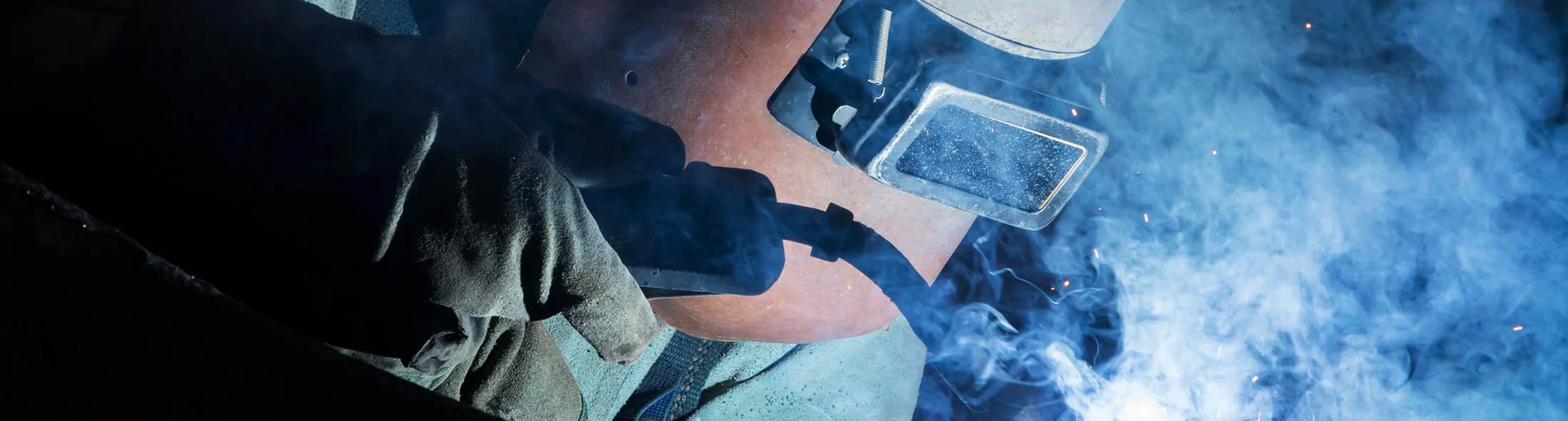 An employee welds components of a ship at the Hyundai Heavy Industries Co. shipyard in Ulsan.
