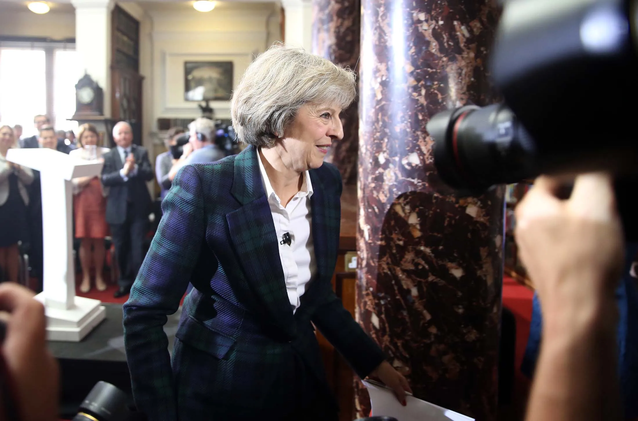Theresa May, U.K. home secretary, departs a news conference to announce her Conservative party leadership bid in London, U.K., on Thursday, June 30, 2016. May, who backed the Remain campaign, will pledge to put a pro-Brexit minister in charge of the negotiations, and plans to say that the process will not be “brief or straightforward”.
