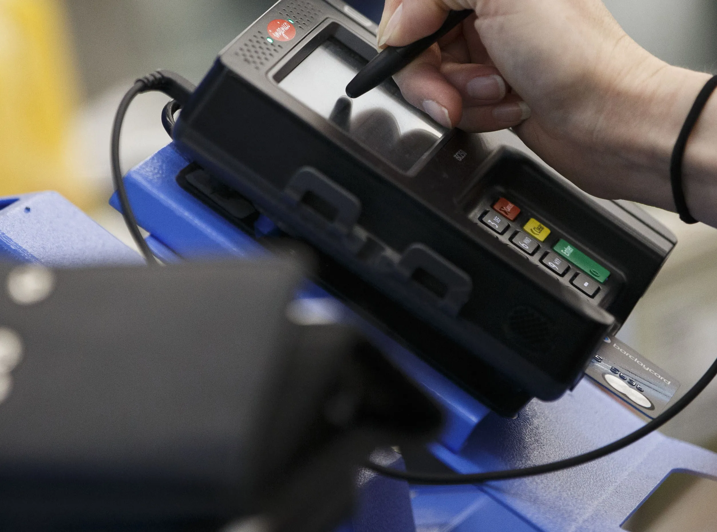A customer signs for a purchase with a Barclaycard MasterCard Inc. chip credit card at a Wal-Mart Stores Inc. location in Burbank, California, U.S., on Tuesday, Nov. 22, 2016. Consumer hardline retailers are hopeful Black Friday will provide a strong start to the holiday shopping season, but any lift may come at the expense of margins, as the landscape has become increasingly promotional.