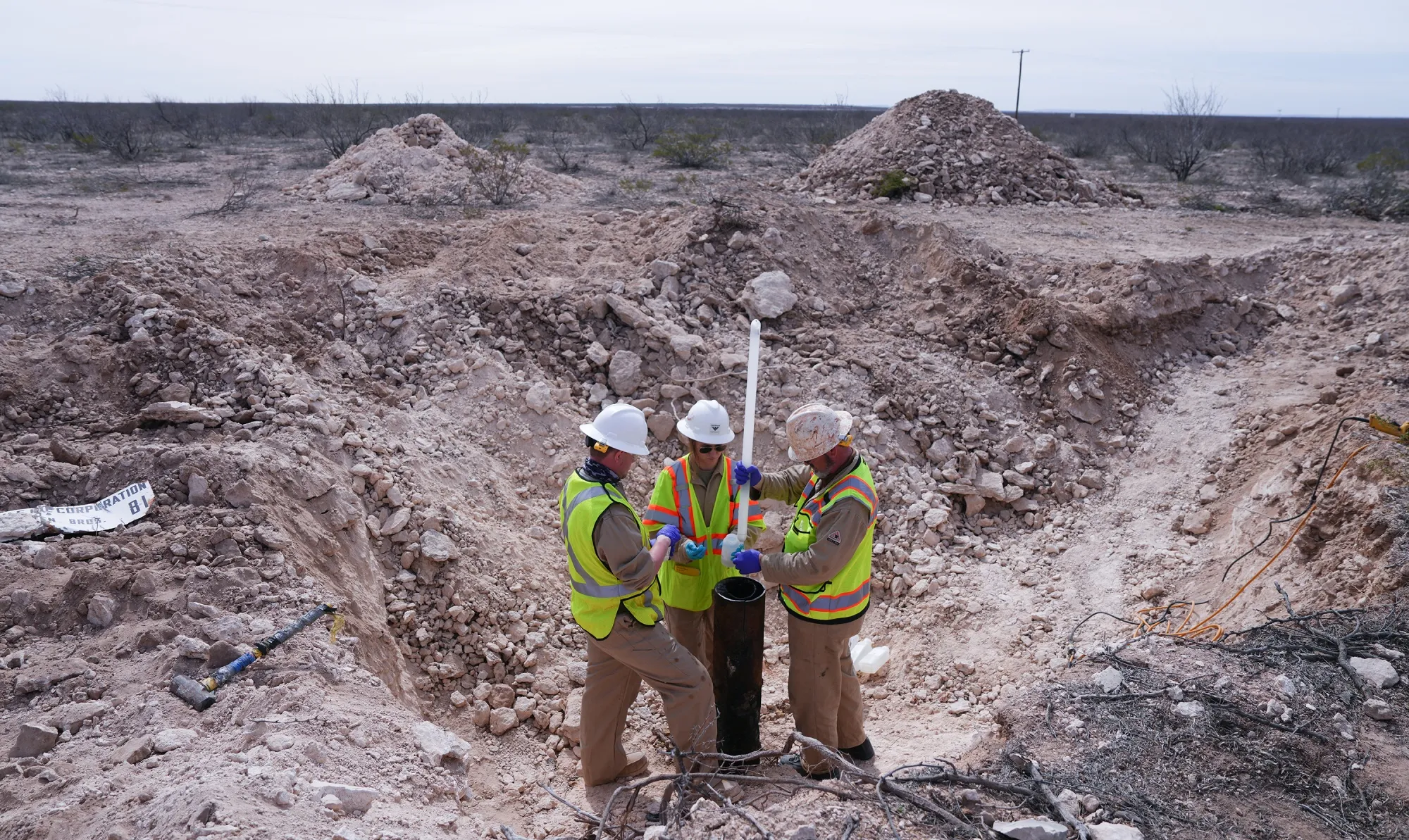 Scientists sample&nbsp;water from a crumbling former oil well on Antina Ranch in 2024.