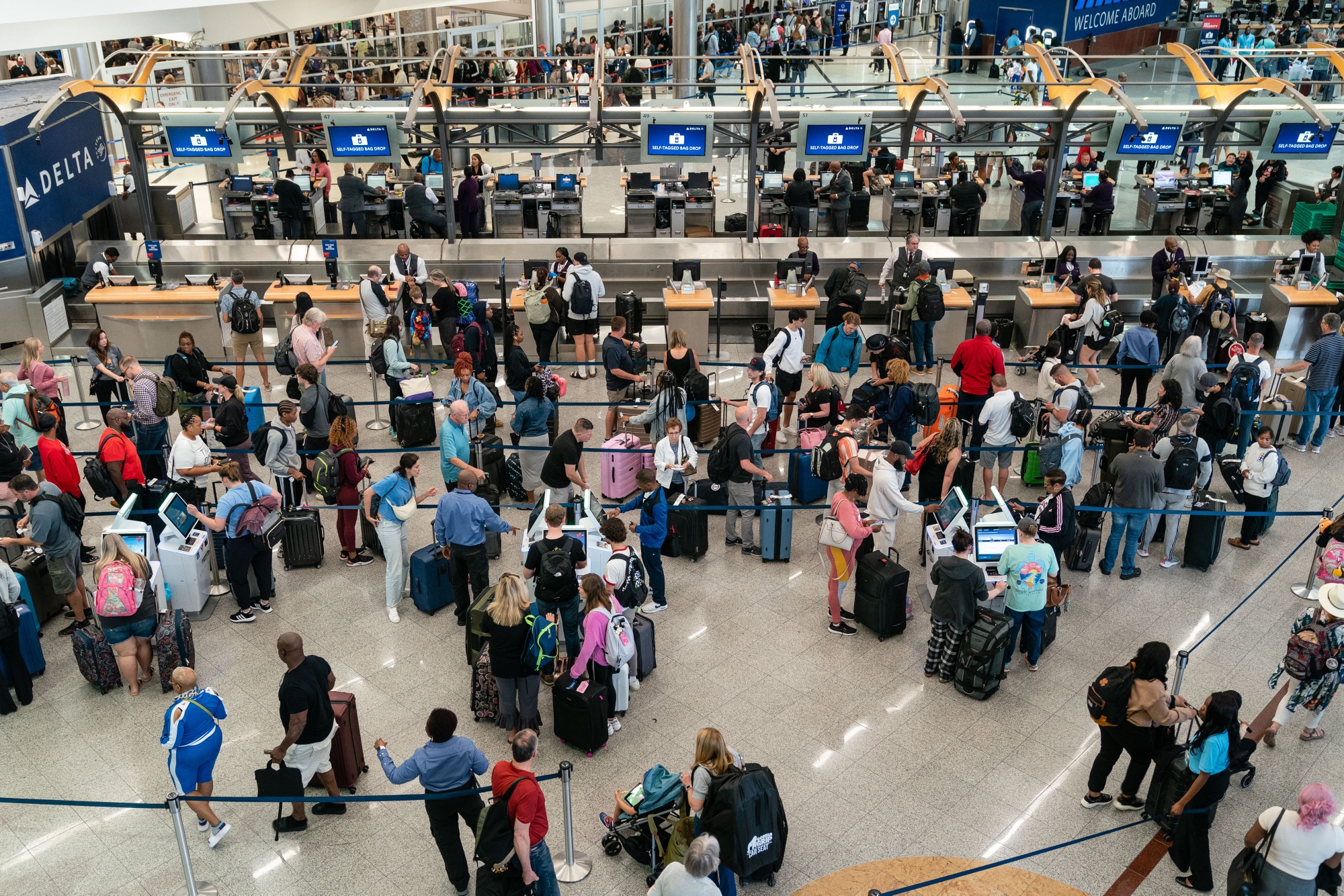 Travelers at Hartsfield-Jackson Atlanta International Airport on May 25.