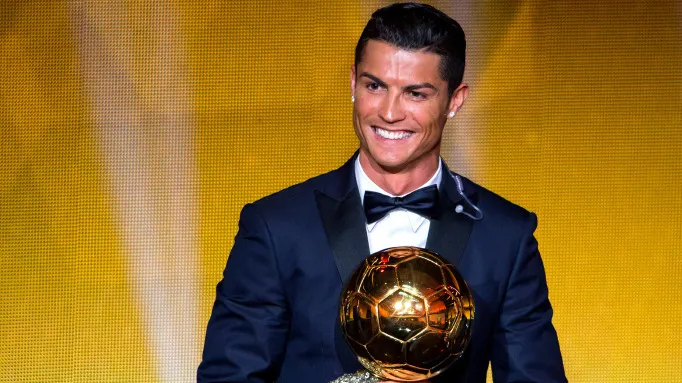 Cristiano Ronaldo receives the 2014 FIFA Ballon d'Or award for the player of the year on January 12, 2015. Photographer: Philipp Schmidli/Getty Images
