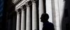 A pedestrian passes in front of the New York Stock Exchange (NYSE) in New York, U.S., on Friday, May 24, 2019. U.S. equities climbed at the end of a bruising week in which escalating trade tensions dominated markets.
