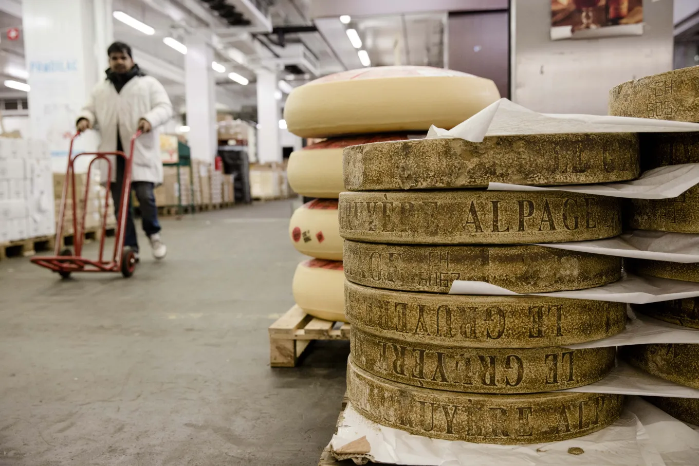 Wheels of Gruyere cheese at the Rungis wholesale food market in France.