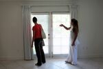 Real estate agent Shellie Young (R) shows a rental home to Dorothea Tittel in Miami. Many young people are now considering renting instead of buying.&#13;

