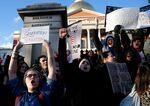 Protesters gather at the Mass. State House in Boston on Jan. 29, to protest President Donald Trump's executive order banning people from several predominantly Muslim countries from entering the country.
