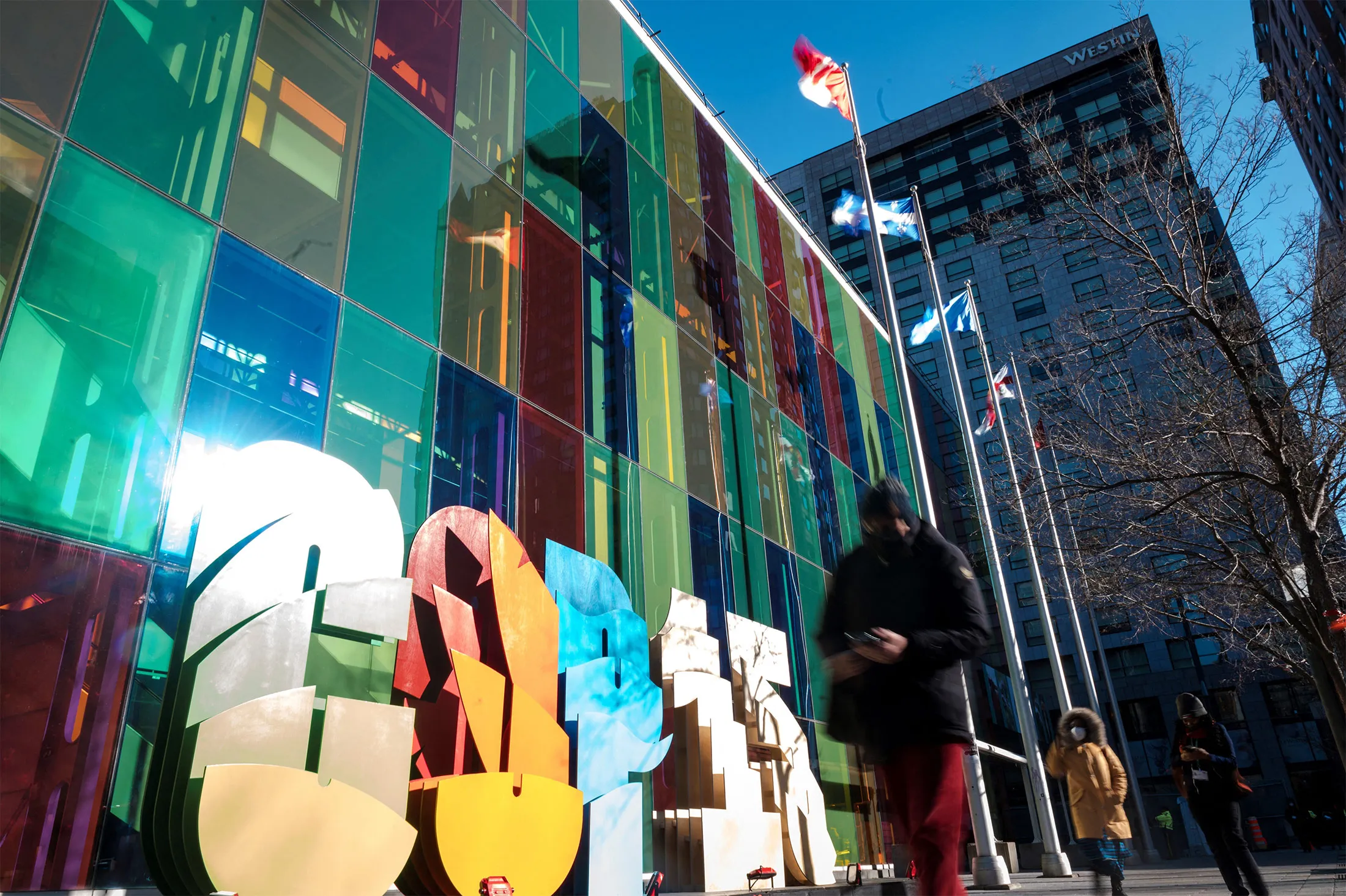 Delegates walk in front of the Palais des Congres during COP15&nbsp;in Montreal, Quebec, on Dec. 13.&nbsp;