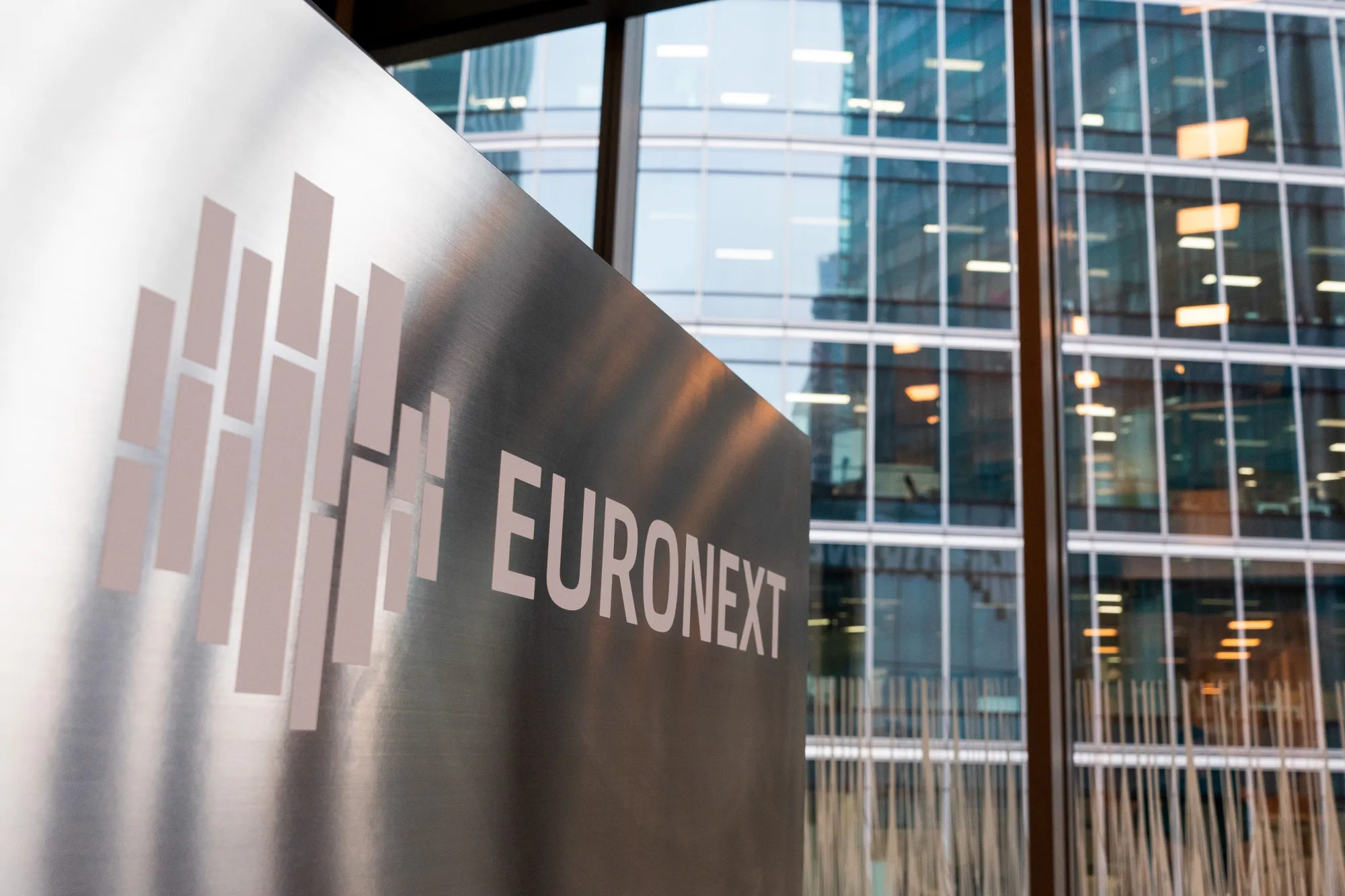 A sign outside the Euronext NV stock exchange in the La Defense business district in Paris, France, on Thursday, Feb. 20, 2025. France's economy is heading for only slight growth at the start of the year and uncertainty remains high for business leaders, the country's central bank said.