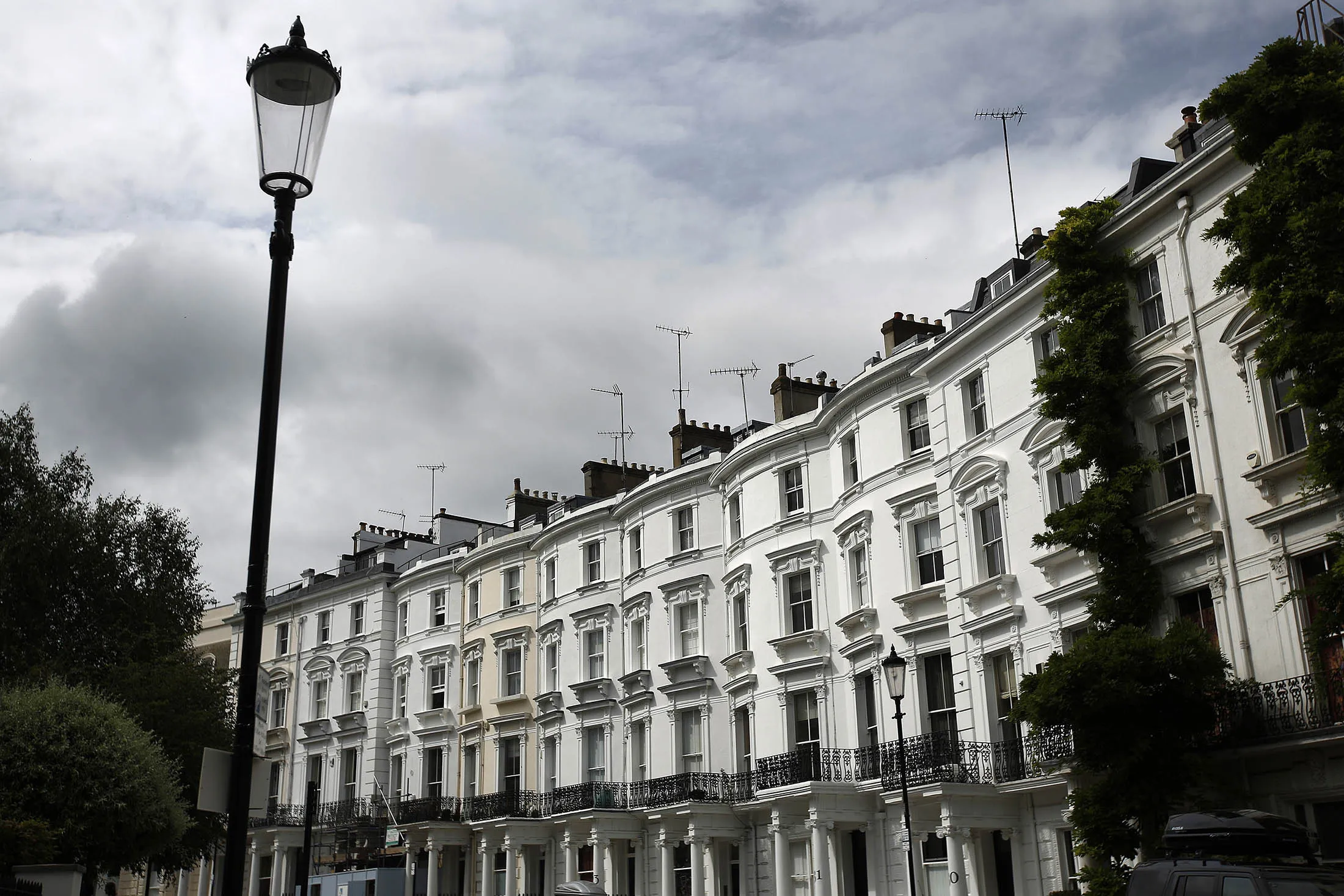 Rows of luxury residential properties stand on Lansdowne Crescent in the Kensington and Chelsea district of London.
