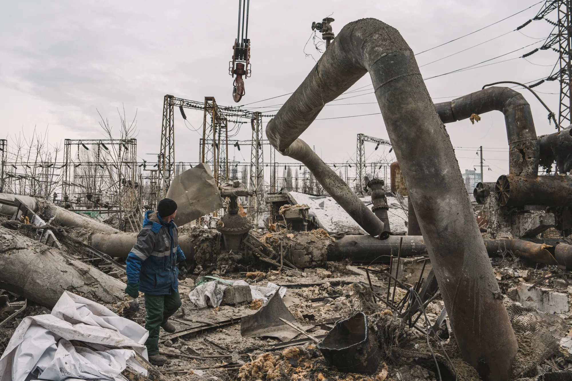 Workers clear damaged pipework at the Darnytsia Thermal Power Plant following Russian air strikes in Kyiv on Feb. 4.