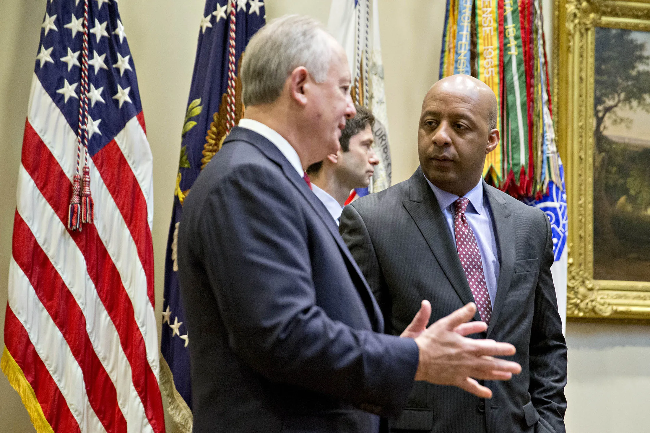 Marvin Ellison, chairman and chief executive officer of J.C. Penny Co., speaks with Greg Sandfort, chief executive officer officer of Tractor Supply Co., before a listening session with Donald Trump at the White House in Washington, D.C., on Feb. 15, 2017.
