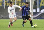 Lautaro Martinez of FC Internazionale, right,&nbsp;is challenged by Nicolo Cambiaghi of Empoli FC during a&nbsp;Serie A match&nbsp;in Milan, on Jan. 23.
