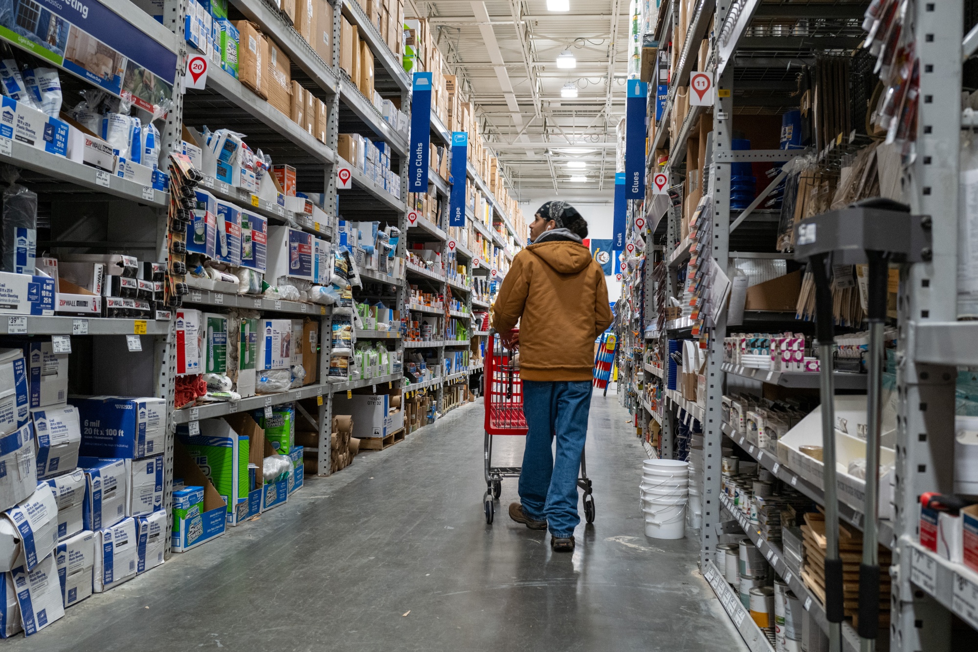 A customer shops at a home improvement store in New York City.