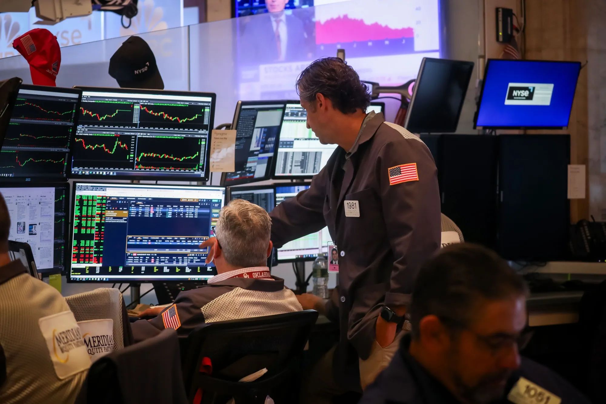 Traders At The NYSE As Stocks Climb On Hopes For Russia Deal As Oil Falls