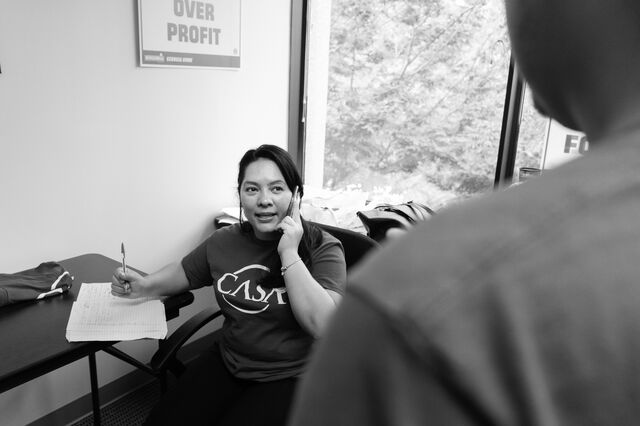 Ovares speaks with her boss at the CASA office in Atlanta.