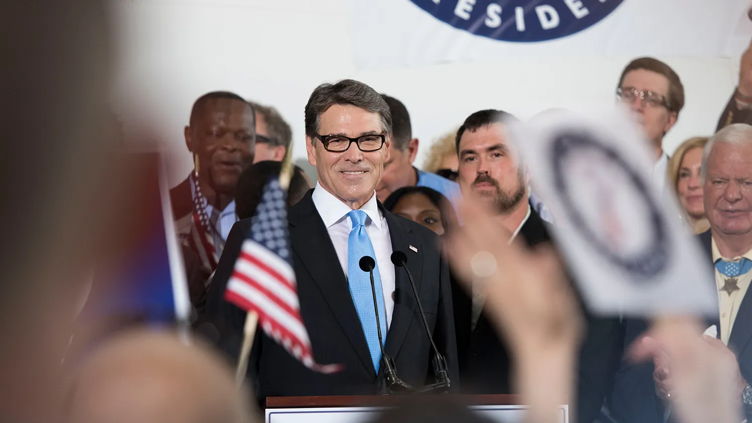 Rick Perry, former governor of Texas, smilles while speaking during an event to formally announce his presidential campaign in a hangar at Addison Airport in Addison, Texas, U.S., on Thursday, June 4, 2015.
