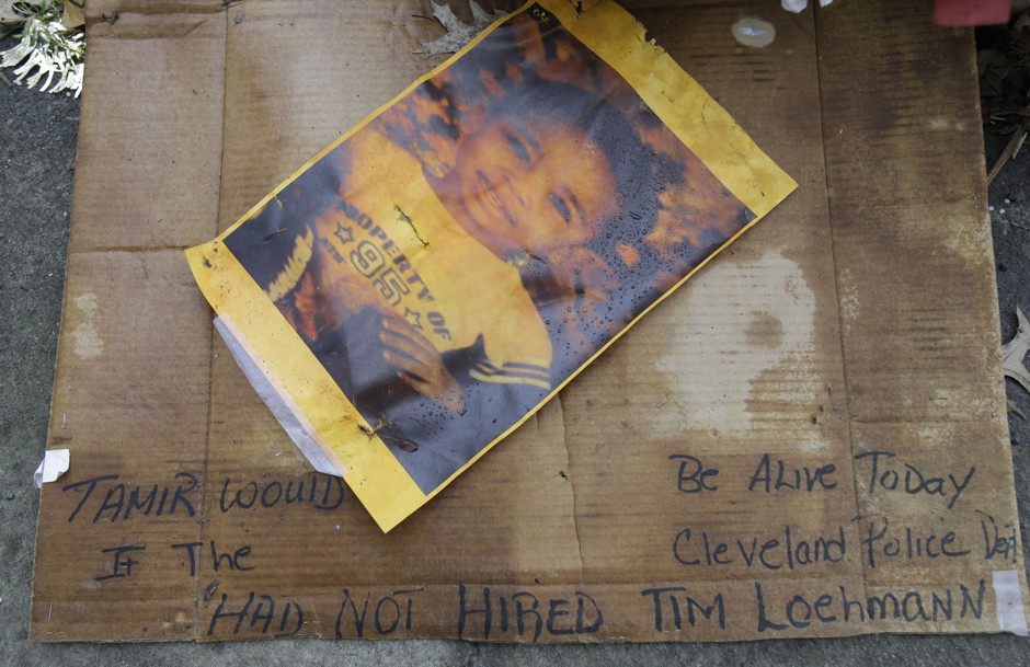 A photo of Tamir Rice rests on the ground near a memorial outside a recreation center Cleveland. 
