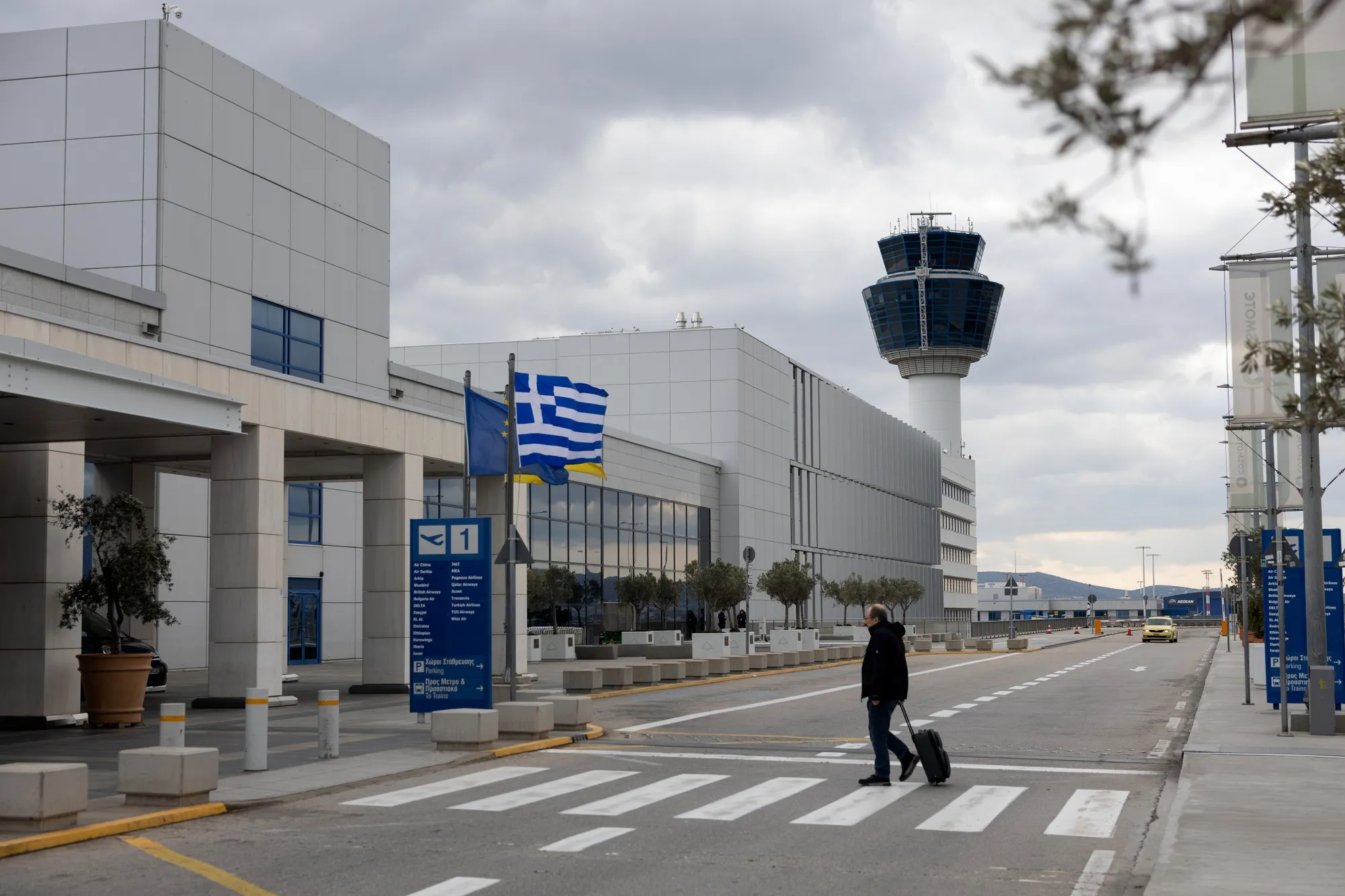 A traveler arrives at Athens International Airport SA in Athens, Greece on Jan. 24.
