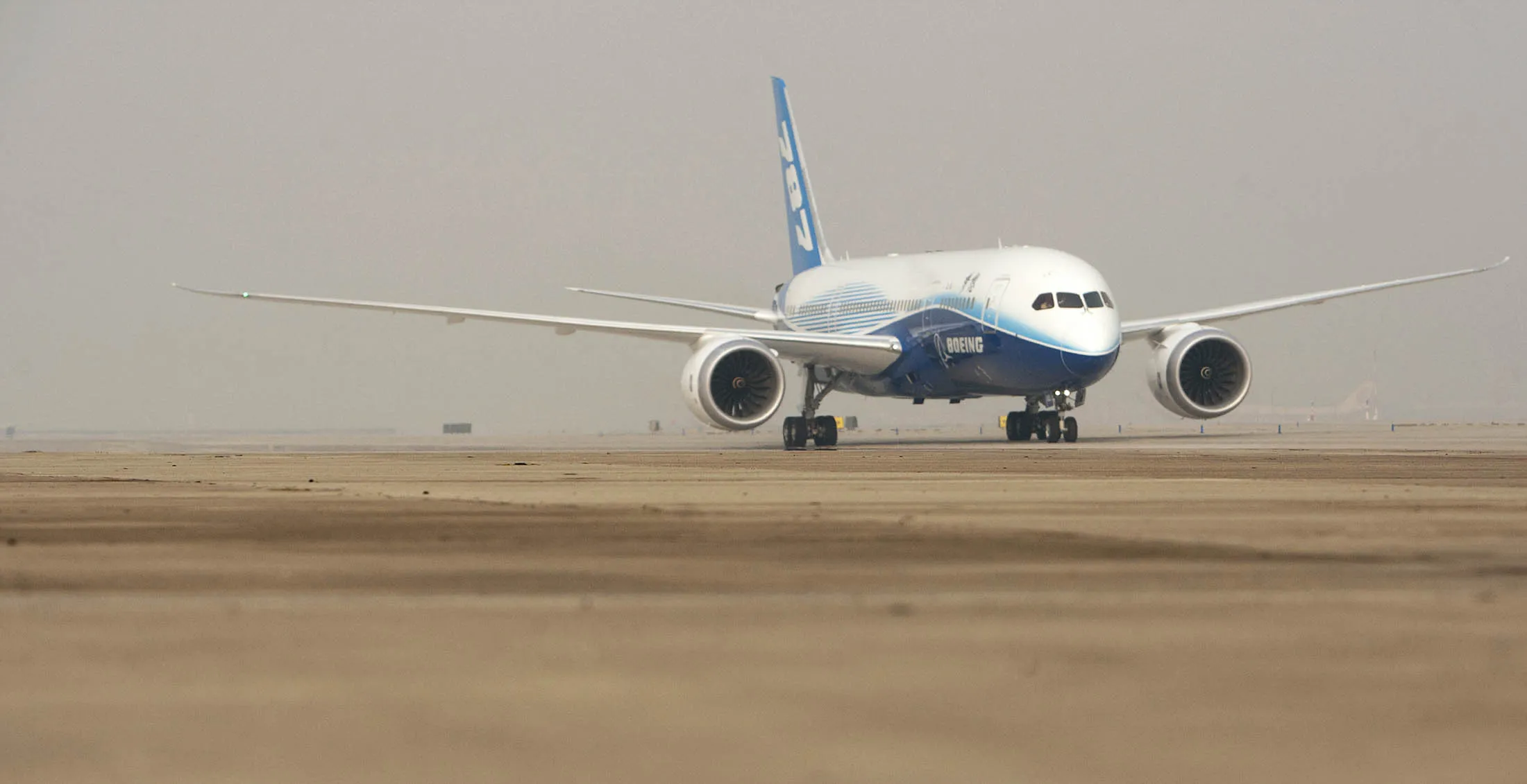 A Boeing Co. 787 Dreamliner taxis after landing at Beijing Captial International Airport in Beijing, China, on Sunday, Dec. 4, 2011. Boeing Co. expects new orders from China for its 787 Dreamliner within 18 months after the nation's biggest airlines warned of canceling purchases following delays.
