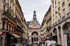 The former headquarters of BNP Paribas SA stand at the end of street in the Grands Boulevards district of Paris, France.
