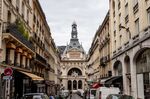 The former headquarters of BNP Paribas SA stand at the end of street in the Grands Boulevards district of Paris, France.