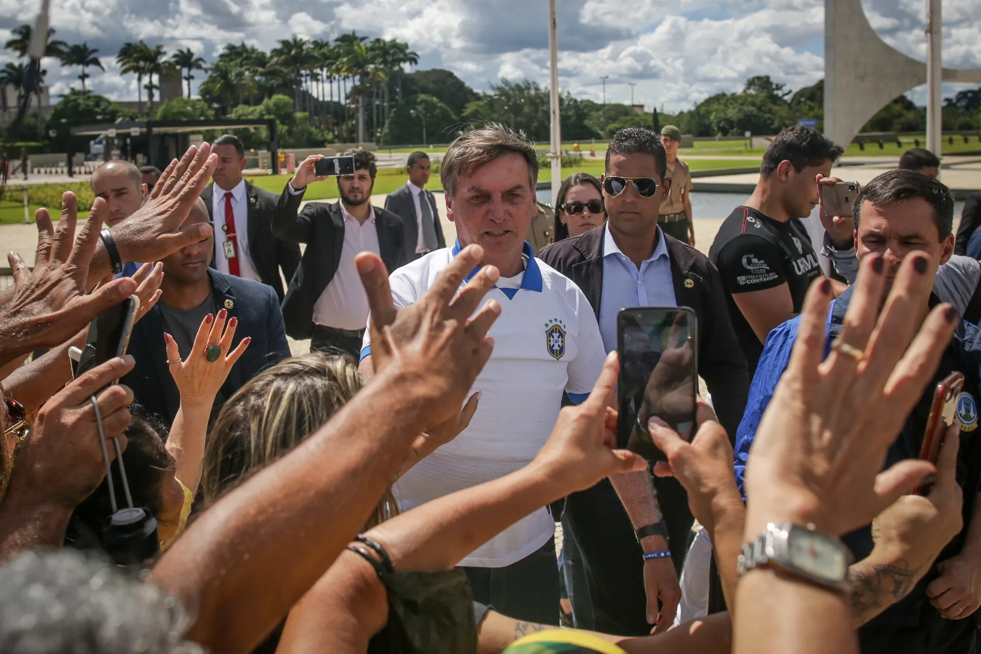 Jair Bolsonaro greets supporters during a demonstration outside of the Planalto Palace in Brasilia, on&nbsp;March 15.