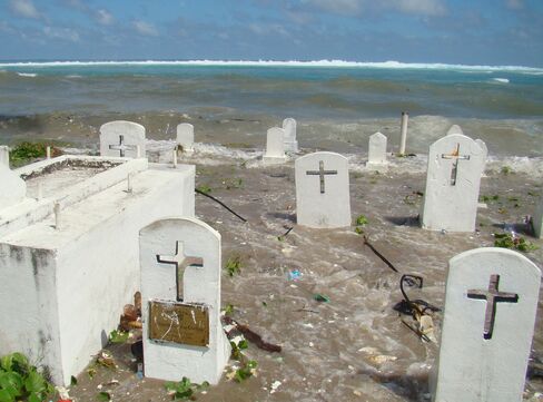 A cemetery on the shoreline in Majuro Atoll being flooded from high tides and ocean surges in the Marshall Islands.