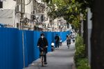 Fences surround a neighborhood placed under lockdown due to Covid-19 in Shanghai on Oct. 26.