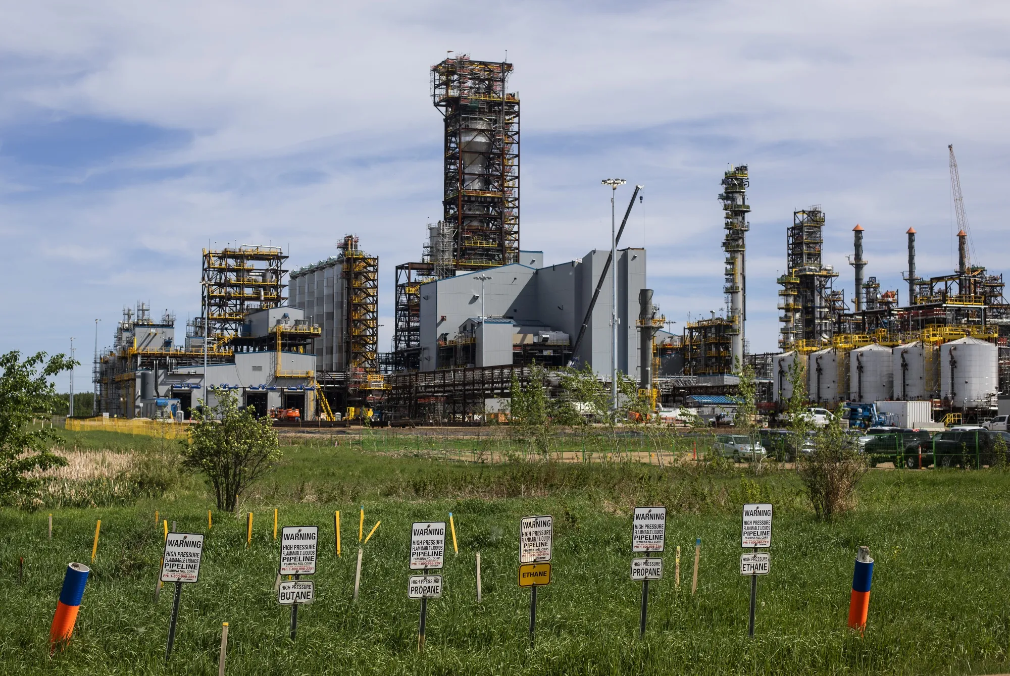 Pembina NGL pipeline warning signs are posted outside the Inter Pipeline Heartland Petrochemical Complex under construction in Strathcona County, Alberta, Canada.