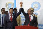 Hassan Sheikh Mohamud, right, after his swearing in, in Mogadishu, on May 16.