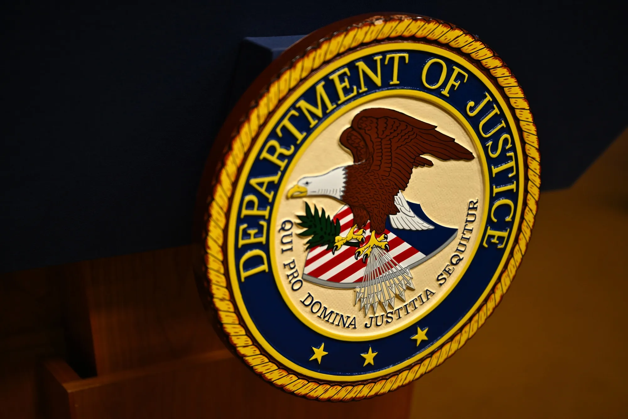 The seal of the Department of Justice.