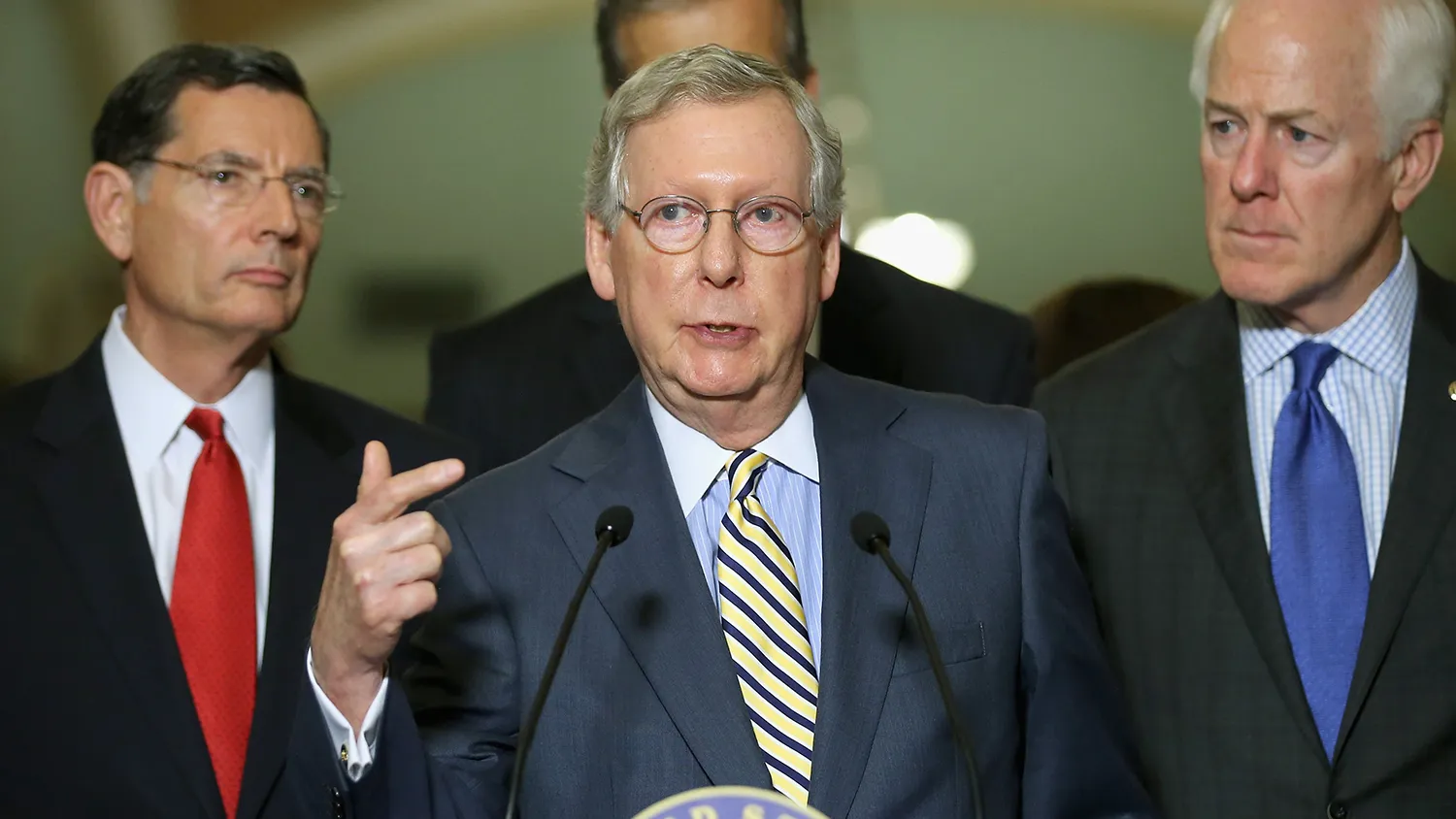 Senate Majority Leader Mitch McConnell (R-KY) (C) talks to reporters with Sen. John Barrasso (R-WY) (L) and Senate Majority Whip John Cornyn (R-TX) after the weekly Republican Senate policy luncheon at the U.S. Capitol June 23, 2015 in Washington, DC.
